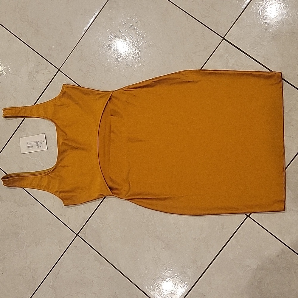Mustard colored bodycon dress in size Medium.